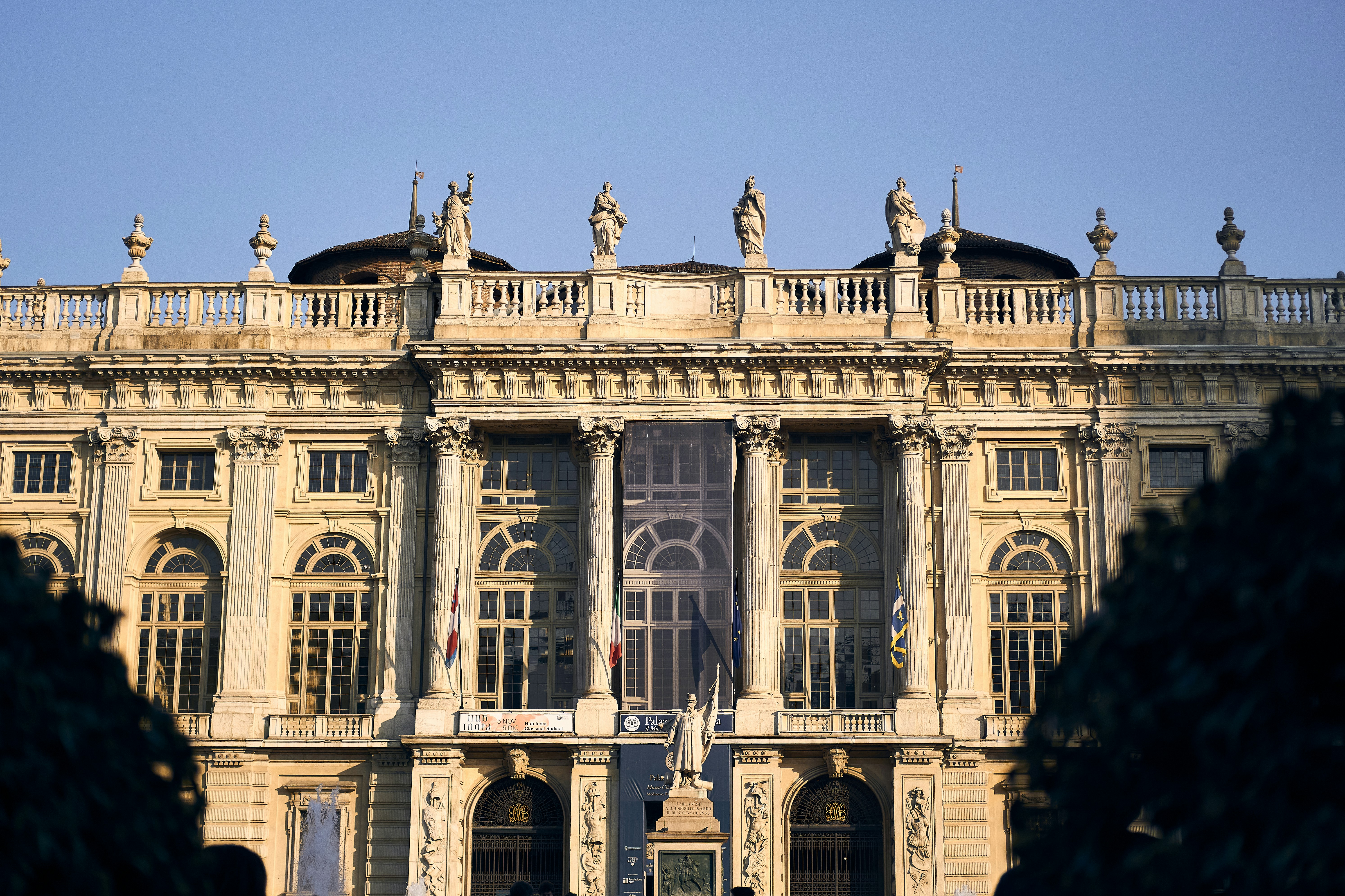 a large building with statues on top of it